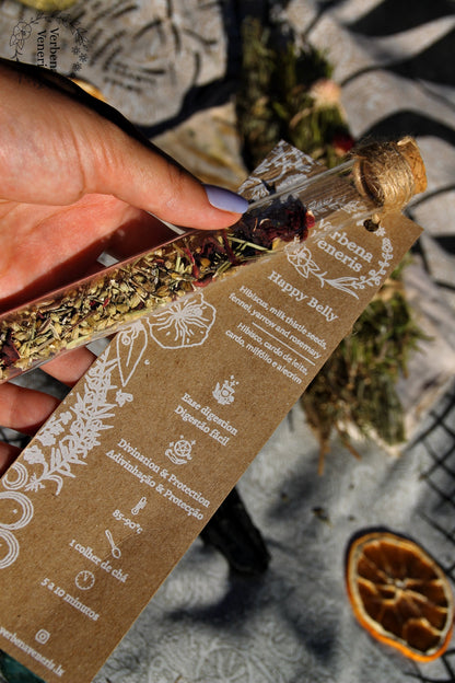 Close up of the chemist  glass tube containing the herbal blend happy belly