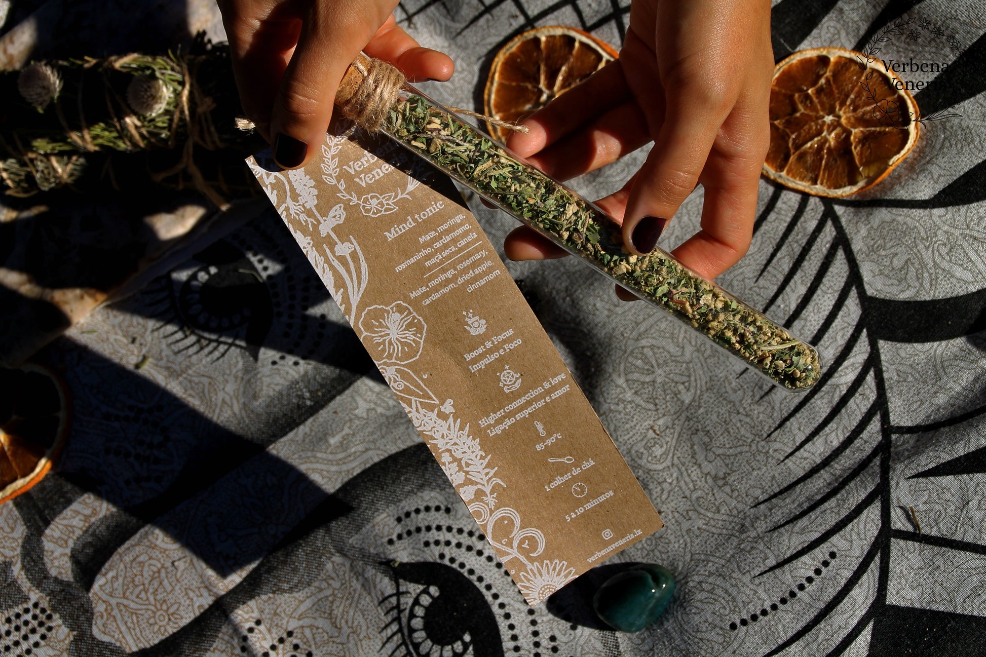 chemist glass tube closed with a cork top tighten with some  ropes. It contains the herbal blend called Mind Tonic. A kraft label tag is attached to it, with all the information regarding the herbs.