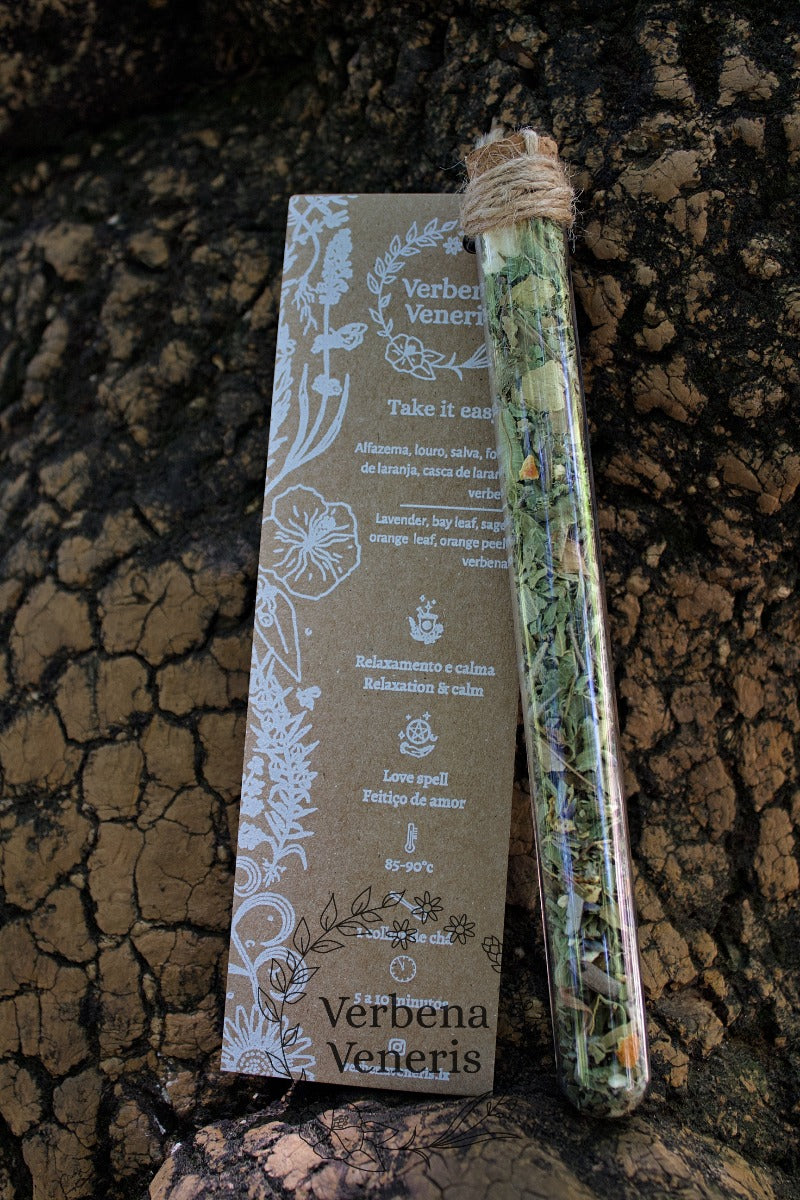 chemist glass tube closed with a cork top tighten with some  ropes. It contains the herbal blend called Take it easy A kraft label tag is attached to it, with all the information regarding the herbs.